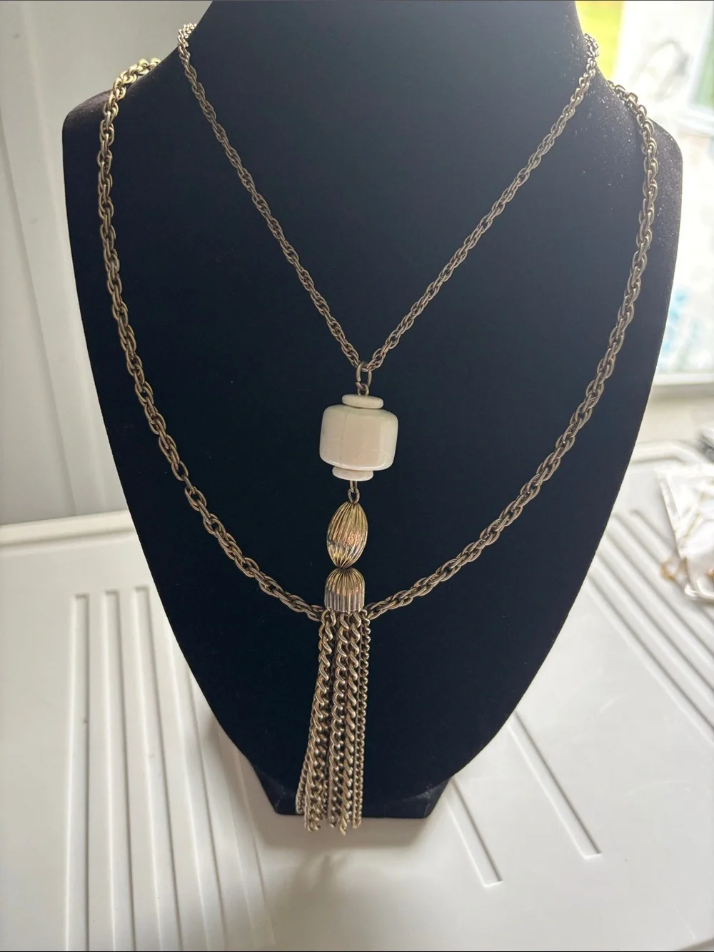 Gold-Tone Double Chain Necklace with White Bead and Tassel Pendant